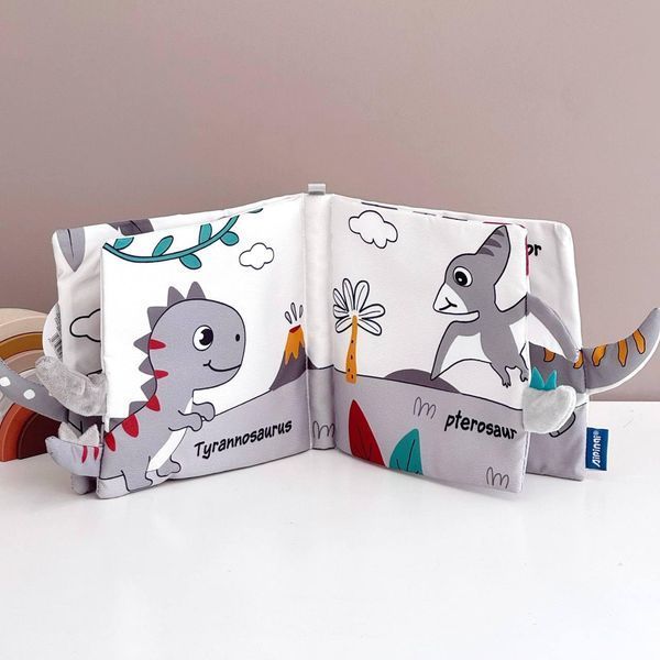 Розвиваюча м&rsquo;яка книжечка шуршалка з хвостиками Happy Baby "Динозаври" HB0072B фото
