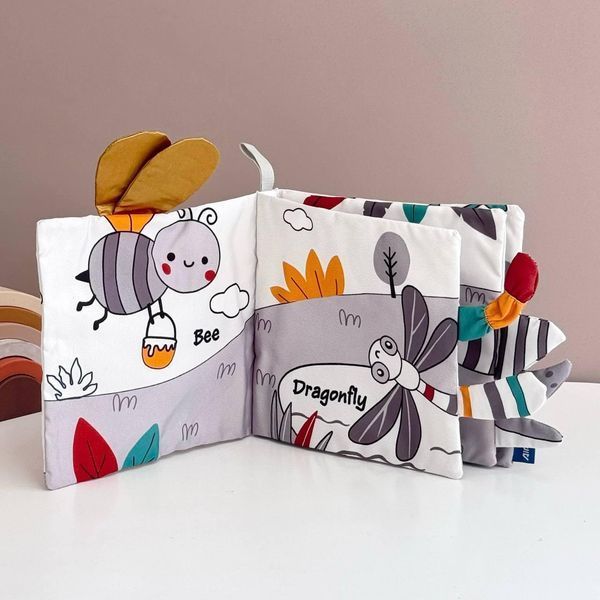 Розвиваюча м&rsquo;яка книжечка шуршалка з хвостиками Happy Baby "Комашки" HB0072A фото